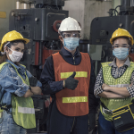 three supply chain professionals in masks