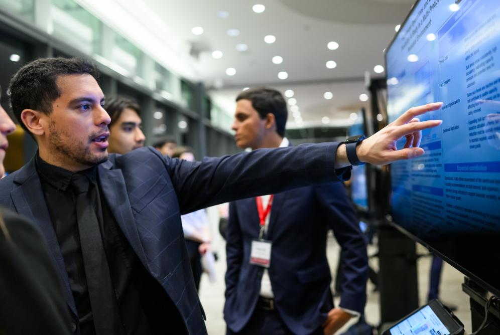 man pointing at screen