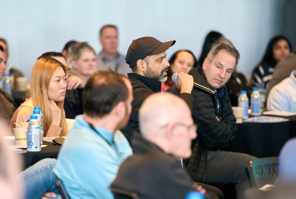 Audience member talks into microphone