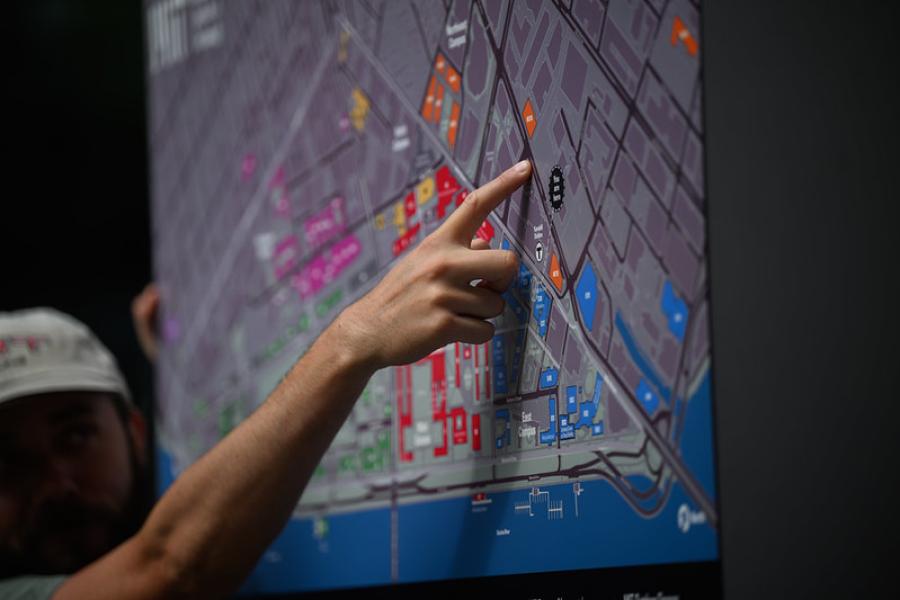 Close up hand pointing to a map