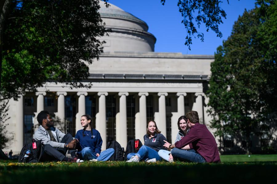 Students on grass outside MIT dome