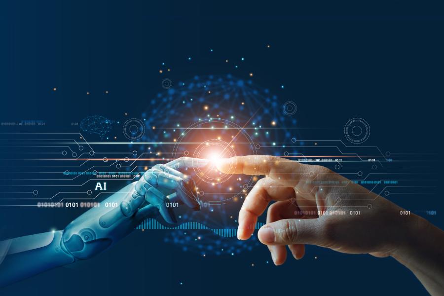 Stock image of a digital hand touching a human hand