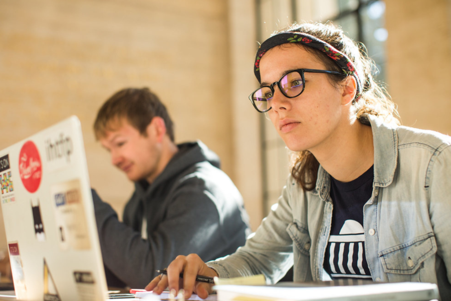MIT student working on laptop