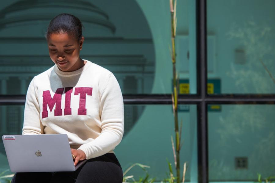MIT student working on laptop