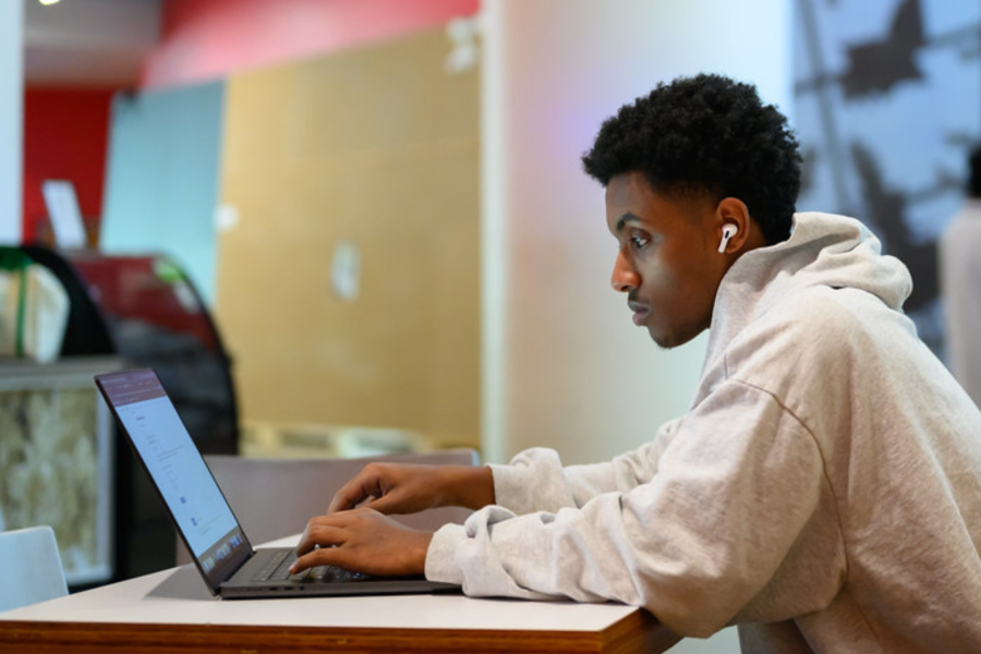 MIT student working on laptop